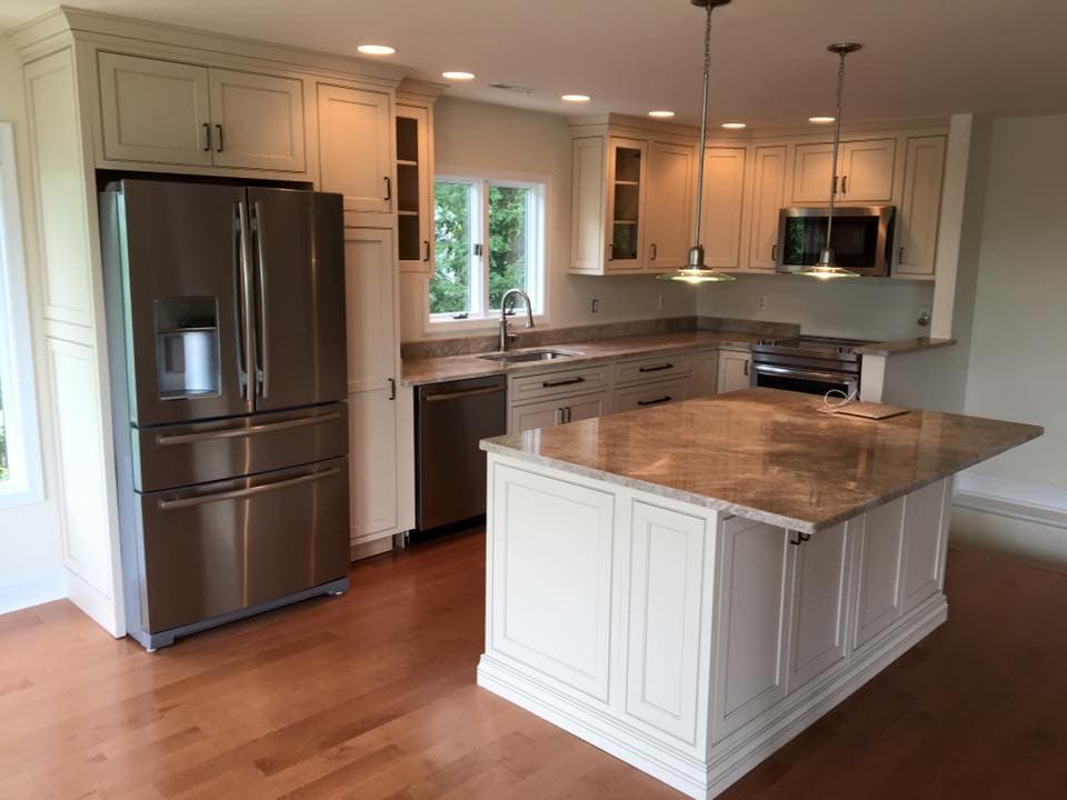 White shaker kitchen with a butcher block island top, photo 1